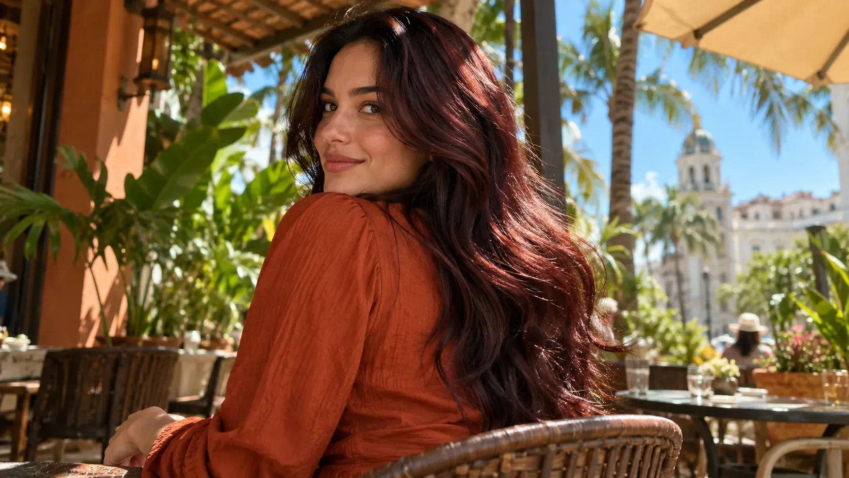 Dark Asian hair with a rich burgundy-brown tint glowing in sunlight